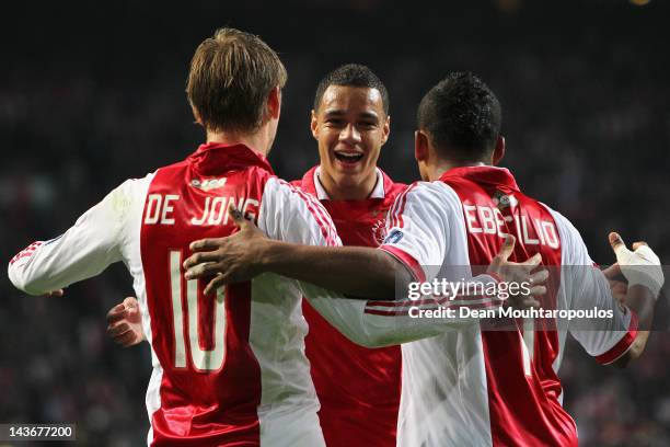 Siem de Jong of Ajax is congratulated by team mates Gregory van der Wiel and Lorenzo Ebecilio after he scores the second goal of the game during the...