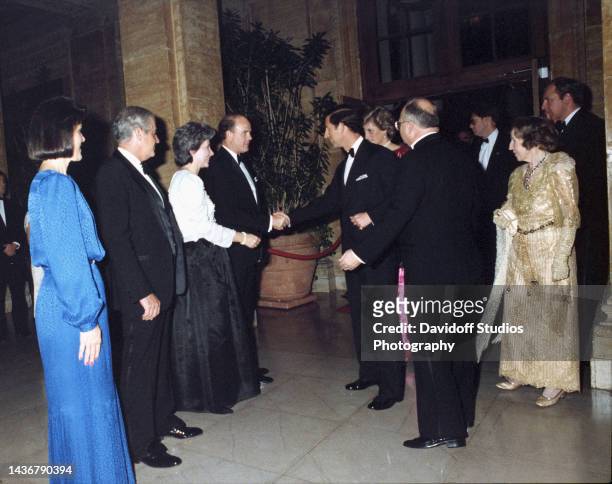 Prince Charles and Princess Diana of Wales greet Breakers Hotel V.P. And General Manager Stayton Addison and Philip Hughs while attending the United...
