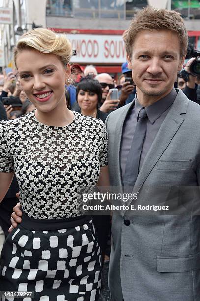Actor Jeremy Renner poses with actress Scarlett Johansson of "Marvel's The Avengers" as she is honored on the Hollywood Walk of Fame on May 2, 2012...