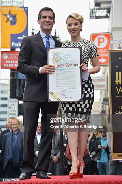 City Council President Eric Garcetti poses with actress Scarlett Johansson of "Marvel's The Avengers" as she is honored on the Hollywood Walk of Fame...