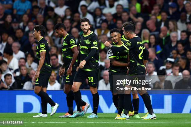 Marcus Edwards of Sporting CP celebrates with teammates after scoring their side's first goal during the UEFA Champions League group D match between...