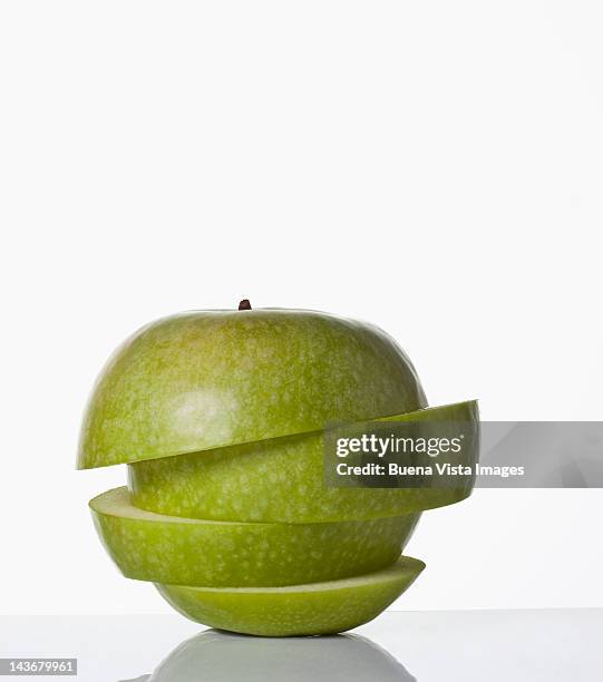 sliced apple - green apple slices stock pictures, royalty-free photos & images