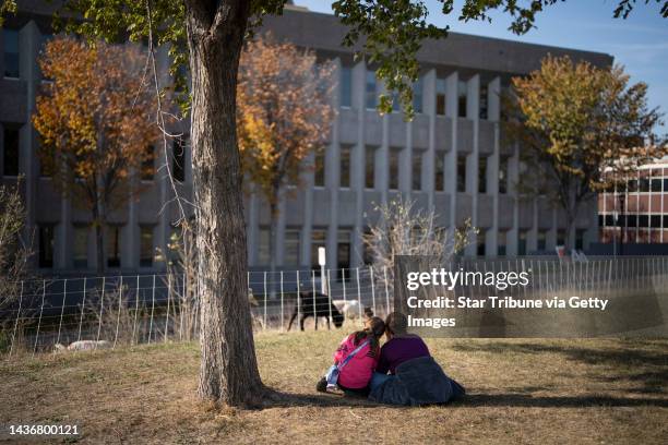 Leah Lawrence and her daughter Gretchen stopped to watch goats and sheep graze on invasive species on a field nearby the Minnesota State Capitol on...