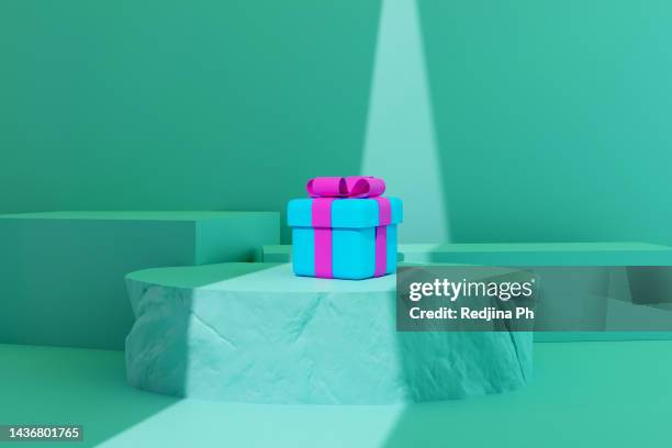 empty stone minimalistic podium with sblue and red gift box in the background. place for text, copyspace. shadow. presentation pedestal product, goods. - the gift photo exhibit stock pictures, royalty-free photos & images