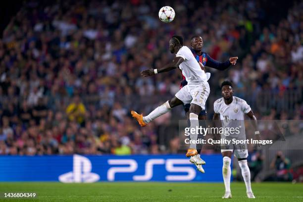 Ousmane Dembele of FC Barcelona competes for the ball with Sadio Mane of Bayern Munchen during the UEFA Champions League group C match between FC...