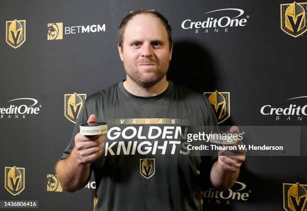 Phil Kessel of the Vegas Golden Knights poses with the pucks from his 990th consecutive NHL game breaking the record owned by Keith Yandle for the...