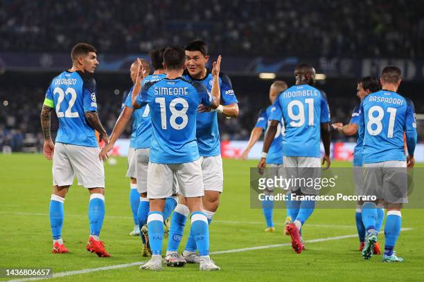 Giovanni Simeone of Napoli celebrates scoring their side's second goal with teammates during the UEFA Champions League group A match between SSC...