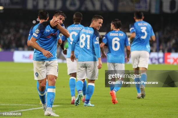 Giovanni Simeone of Napoli celebrates scoring their side's second goal with teammates during the UEFA Champions League group A match between SSC...