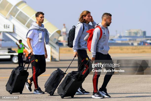 Rodrigo Caio, Filipe Luis and Everton Ribeiro of Flamengo arrive at Simon Bolivar Air Base on October 26, 2022 in Guayaquil, Ecuador. Flamengo and...