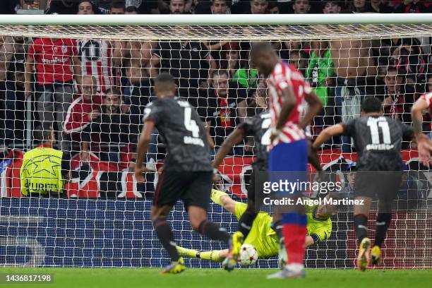 Lukas Hradecky of Bayer 04 Leverkusen saves a penalty from Yannick Ferreira Carrasco of Atletico Madrid during the UEFA Champions League group B...