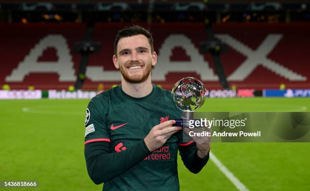 Andy Robertson of Liverpool with the Player of the Match trophy at the end of the UEFA Champions League group A match between AFC Ajax and Liverpool...
