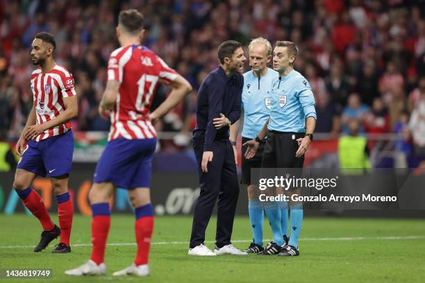 Xabi Alonso, Head Coach of Bayer 04 Leverkusen speaks to Referee Clement Turpin after their sides draw during the UEFA Champions League group B match...