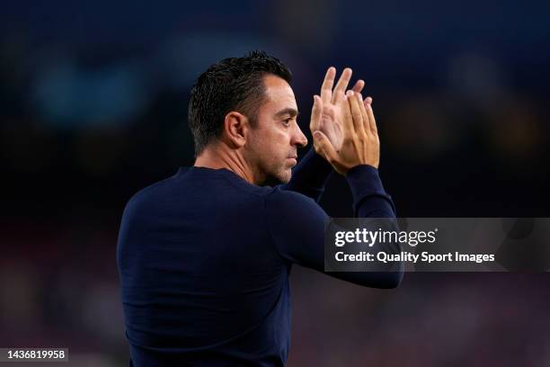 Xavi Hernandez, Manager of FC Barcelona applauds the fans following their side's defeat and elimination from the UEFA Champions League in the UEFA...