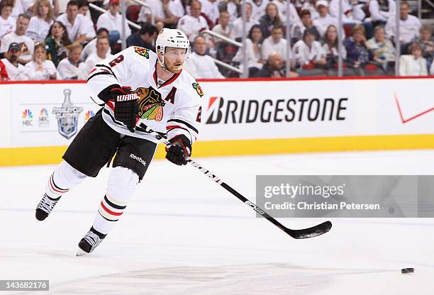 Duncan Keith of the Chicago Blackhawks skates with the puck in Game Five of the Western Conference Quarterfinals against the Phoenix Coyotes during...