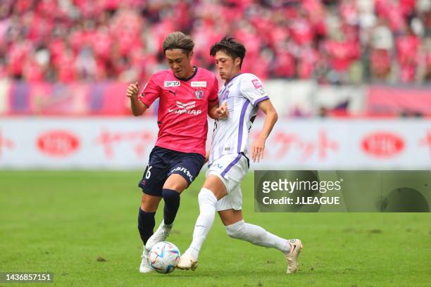 Seiya MAIKUMA of Cerezo Osaka and Takumu KAWAMURA of Sanfrecce Hiroshima battle for the ball during the J.LEAGUE YBC Levain Cup final between Cerezo...