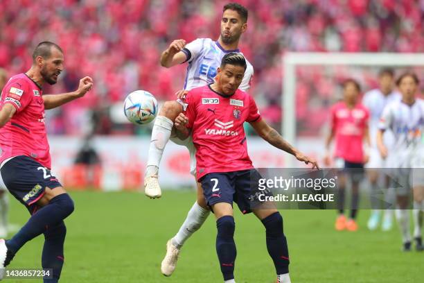 Of Sanfrecce Hiroshima and Riku MATSUDA of Cerezo Osaka battle for the ball during the J.LEAGUE YBC Levain Cup final between Cerezo Osaka and...