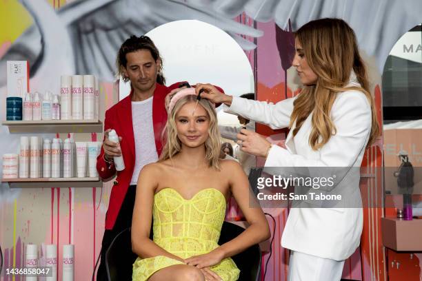 Joey Scandizzo styles a guest during media preview day in the Birdcage at Flemington Racecourse on October 27, 2022 in Melbourne, Australia.