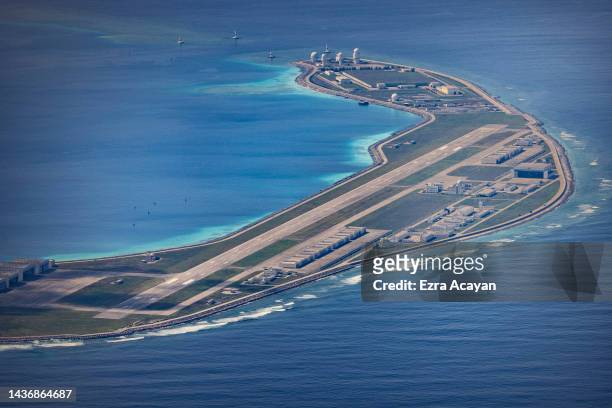 An airfield, buildings, and structures are seen on the artificial island built by China in Mischief Reef on October 25, 2022 in Spratly Islands,...