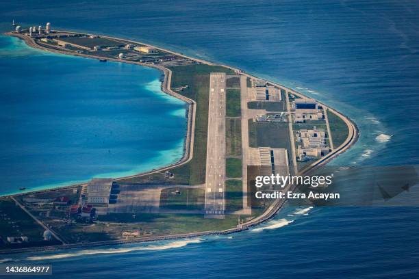 An airfield, buildings, and structures are seen on the artificial island built by China in Mischief Reef on October 25, 2022 in Spratly Islands,...