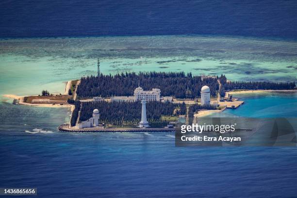 Buildings and structures are seen on the artificial island built by China in Cuarteron Reef on October 25, 2022 in Spratly Islands, South China Sea....