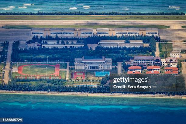 An airfield, buildings, recreational facilities, and other structures are seen on the artificial island built by China in Fiery Cross Reef on October...