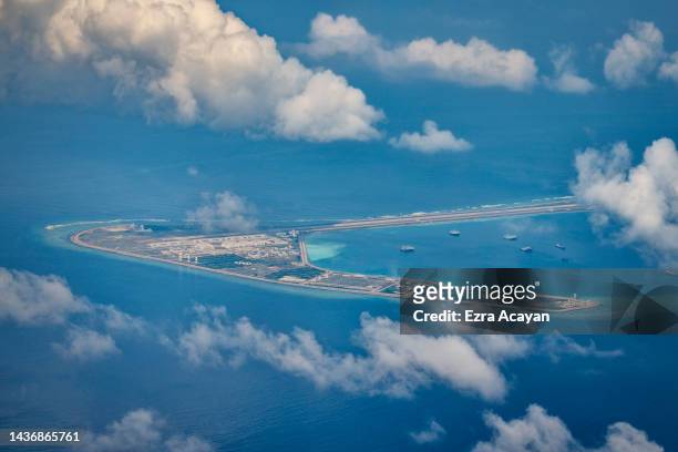 An airfield, buildings, and structures are seen on the artificial island built by China in Subi Reef on October 25, 2022 in Spratly Islands, South...
