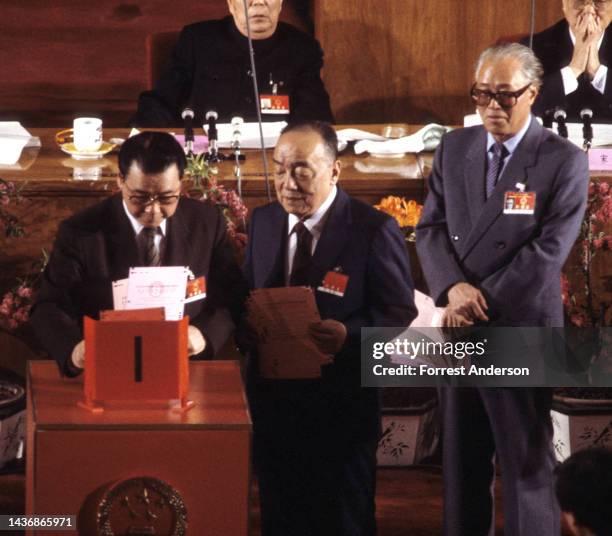 Premier Li Peng , Yang Shangkun , Zhao Ziyang , voting during the National People's Congress in Beijing, China, March 1988.
