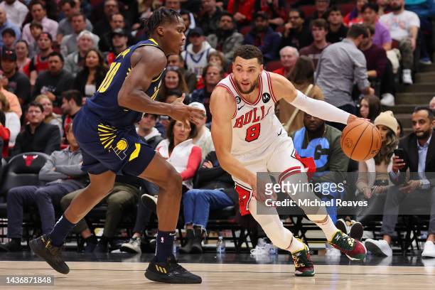 Zach LaVine of the Chicago Bulls drives to the basket against Bennedict Mathurin of the Indiana Pacers during the second half at United Center on...