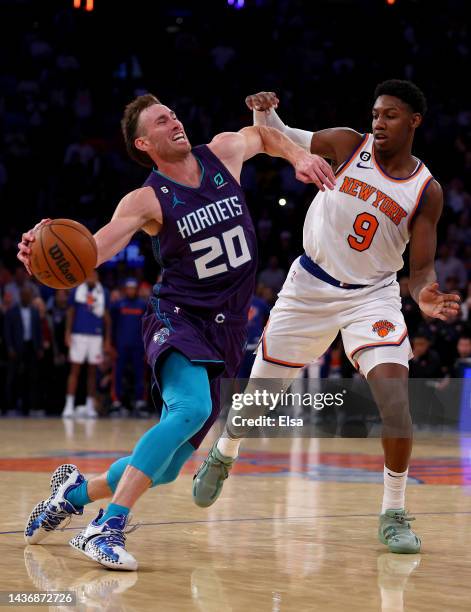 Gordon Hayward of the Charlotte Hornets tries to get past RJ Barrett of the New York Knicks at Madison Square Garden on October 26, 2022 in New York...