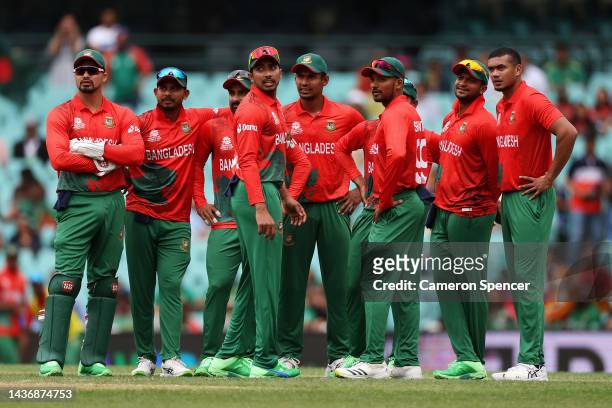 Soumya Sarkar of Bangladesh and team mates wait for a DRS reviewduring the ICC Men's T20 World Cup match between South Africa and Bangladesh at...