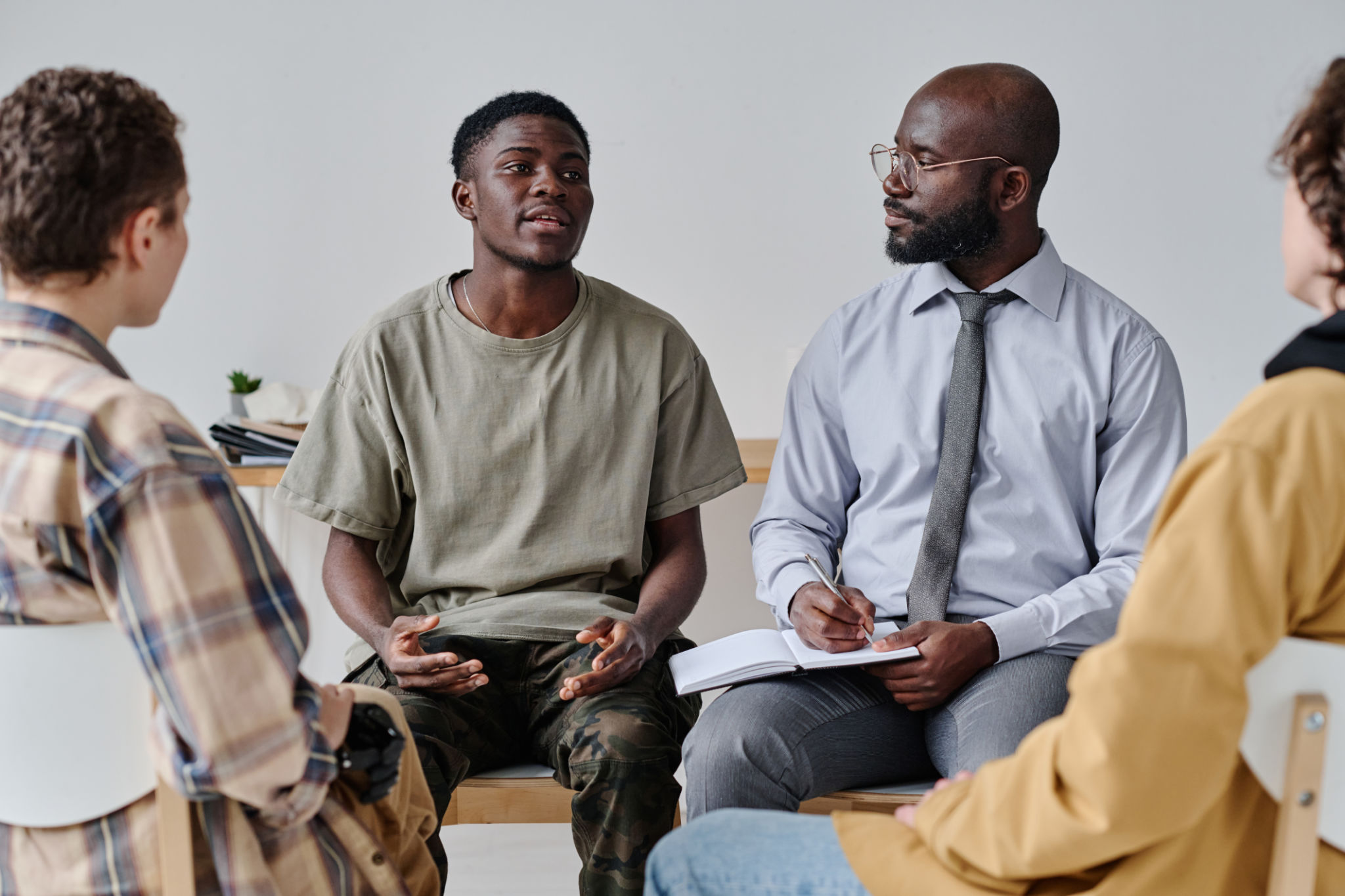 Teenage boy sharing his problems with people Teenage boy sharing his problems with people