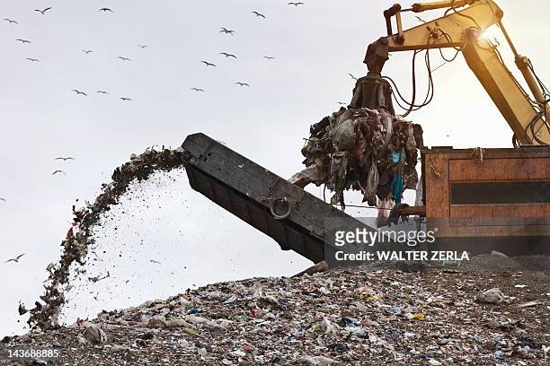 crane at garbage collection center - landfill bildbanksfoton och bilder