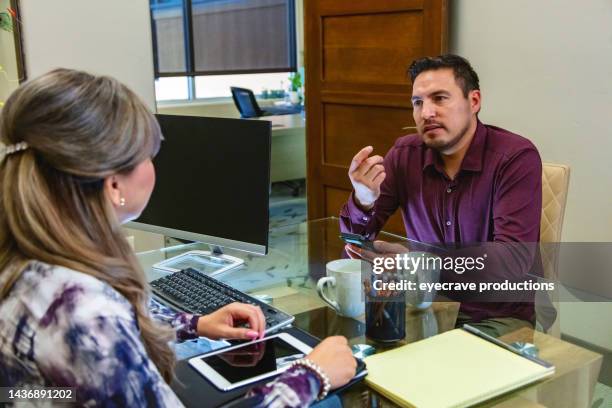 tax relationships in business office hispanic male client and female agent in meeting photo series - co director stock pictures, royalty-free photos & images