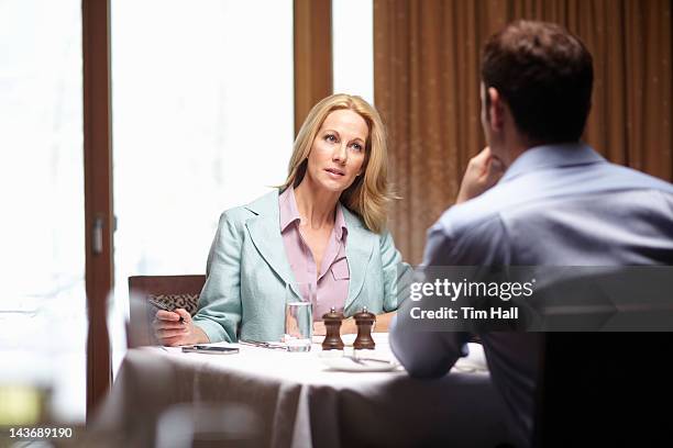 business people talking in cafe - business lunch stock pictures, royalty-free photos & images