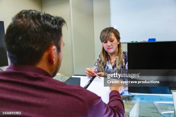 tax relationships in business office hispanic male client and female agent in meeting photo series - co director stock pictures, royalty-free photos & images