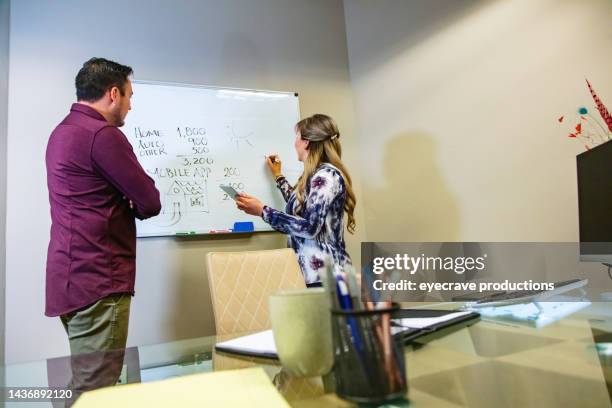 tax relationships in business office hispanic male client and female agent in meeting photo series - co director stock pictures, royalty-free photos & images