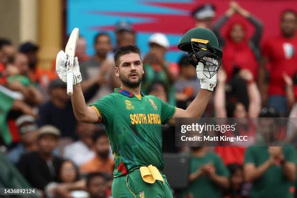 Rilee Rossouw of South Africa raises their bat as they leave the ground after being dismissed for 109 runs during the ICC Men's T20 World Cup match...
