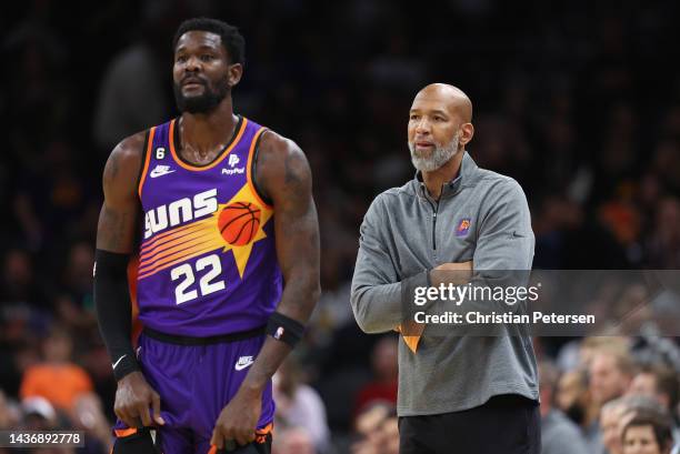 Head coach Monty Williams of the Phoenix Suns stands with Deandre Ayton during the second half of the NBA game at Footprint Center on October 25,...