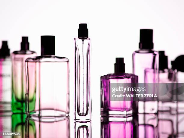 close up of perfume bottles - perfume sprayer stock-fotos und bilder