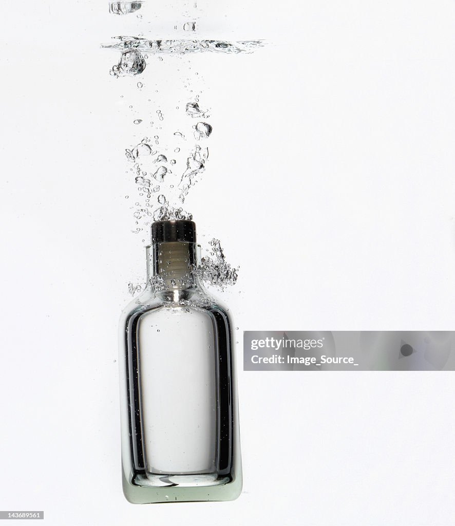 Bottle splashing in water