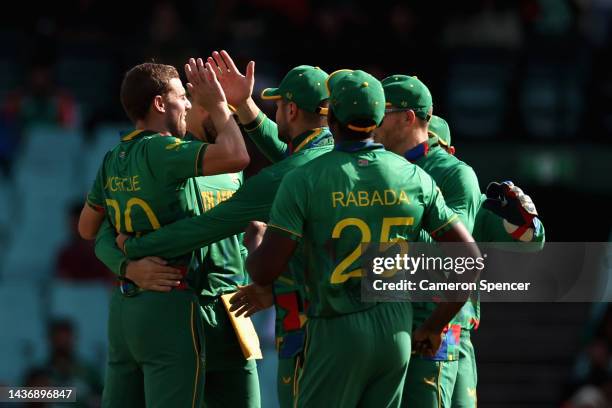 Anrich Nortje of South Africa celebrates with team mates after dismissing Najmul Hossain Shanto of Bangladesh during the ICC Men's T20 World Cup...