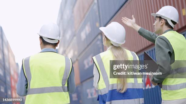rear view. male executive or investor and logistics owner business or manager woman check loading process, meeting, talking and agreement business plan of transport cargo to do together at container loading yard. - private equity stock pictures, royalty-free photos & images