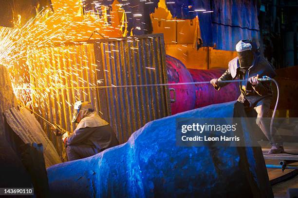 welders at work in steel forge - steel stock pictures, royalty-free photos & images
