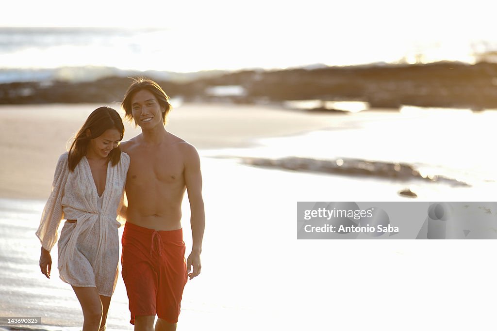 Couple walking together on beach