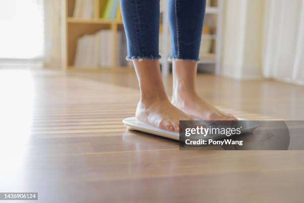 closeup of weighing on scale - woman weight scale stock pictures, royalty-free photos & images