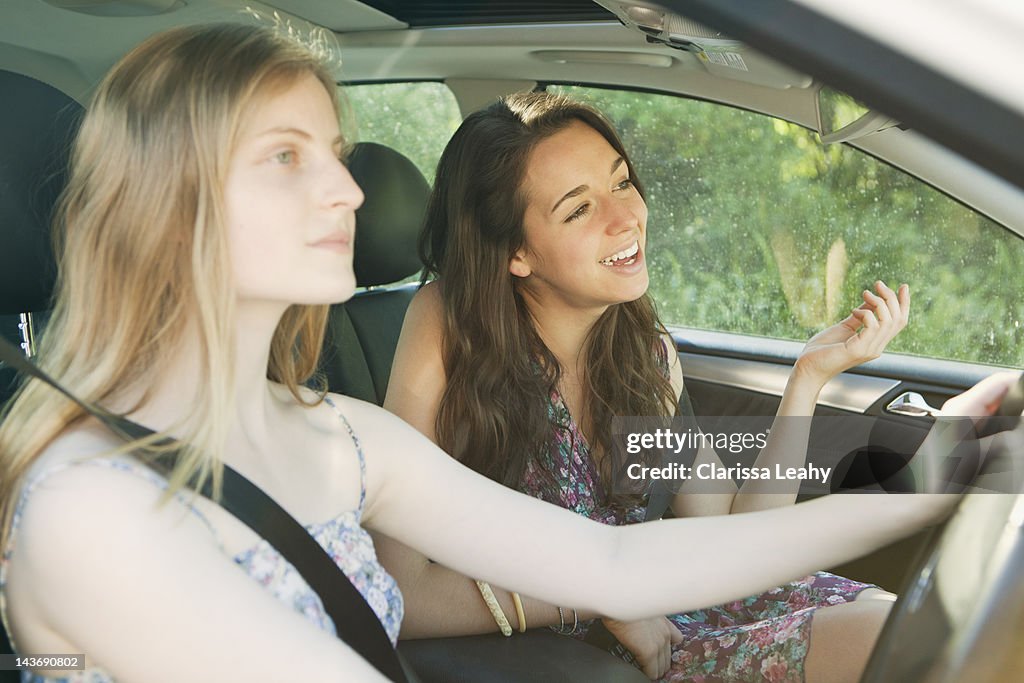 Teenage girls driving car