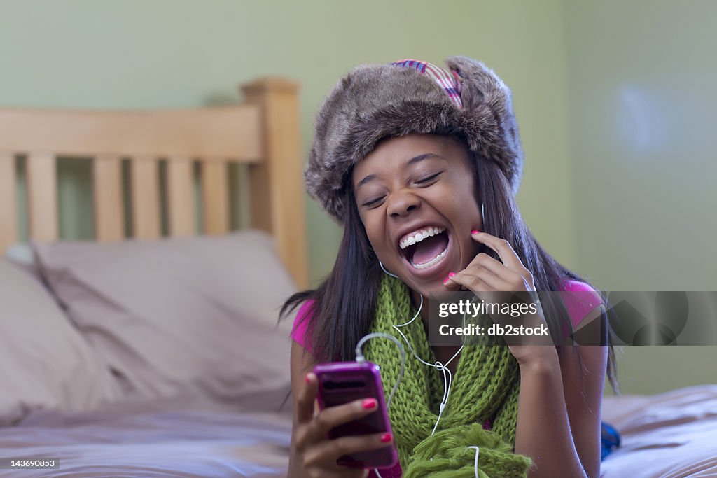 Teenage girl listening to headphones