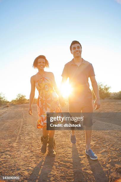 couple walking together in desert - phoenix arizona desert stock pictures, royalty-free photos & images