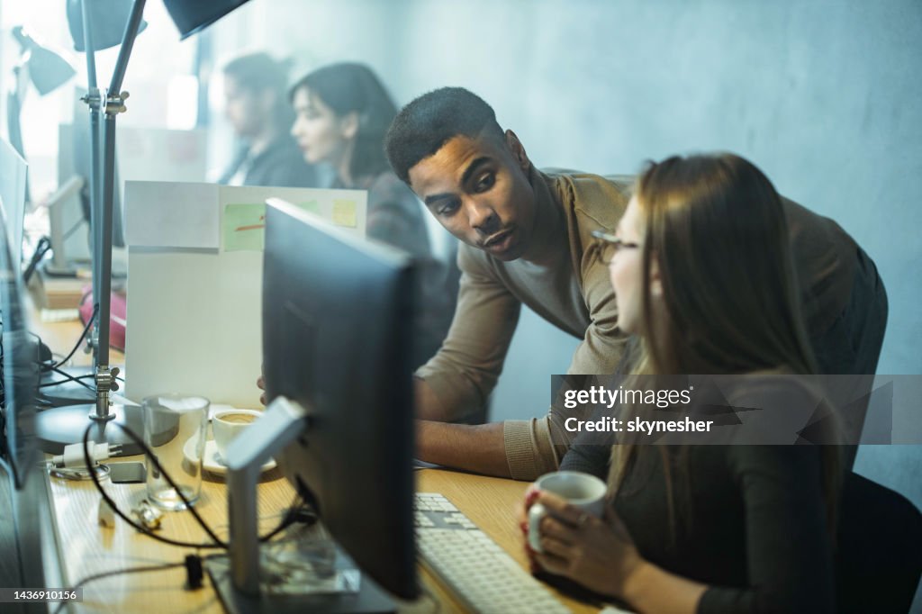 Young Programmers Communicating While Working On Desktop Pc In The ...