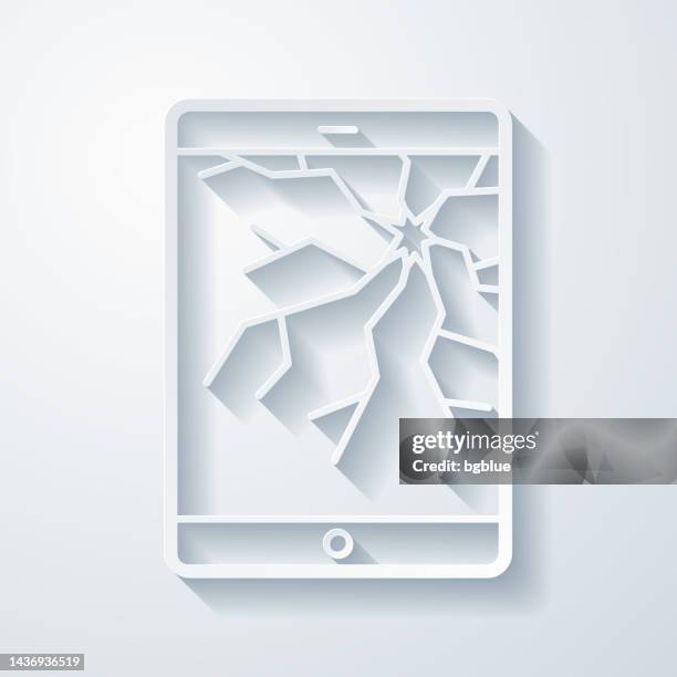 tablet pc with broken screen. icon with paper cut effect on blank background - broken tablet screen stock illustrations